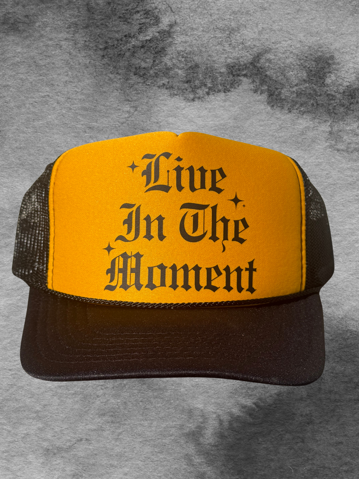 LIVE IN THE MOMENT TRUCKER HAT